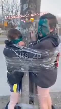 Ukraine: Child and father tied to tree, faces painted, pants removed
