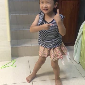 Dancing brother wearing dress