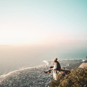 Stop Motion Video of Person Sitting on the Cliff