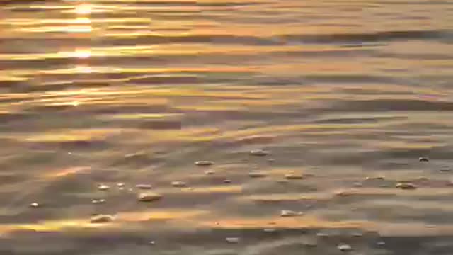 The moment of sunset and its reflection on the sea