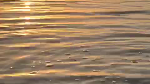 The moment of sunset and its reflection on the sea