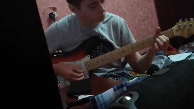 Friend plays the guitar