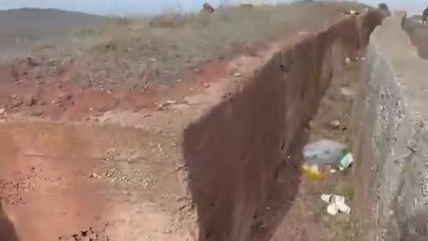 An Israeli soldier shows a Syrian fortification he took without a fight.