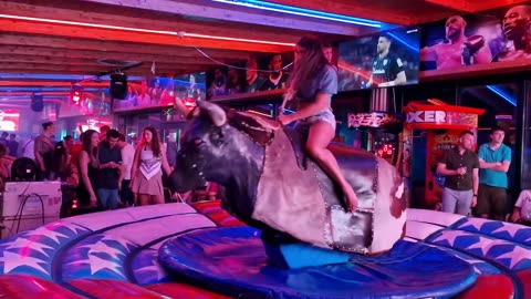 😱 OMG! Pretty Girl Fails at Mechanical Bull Ride in Benidorm | Spain 2024
