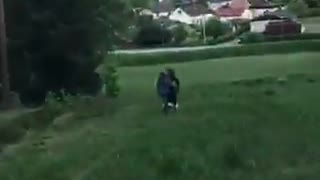 Two girls on tandem bike fall downhill