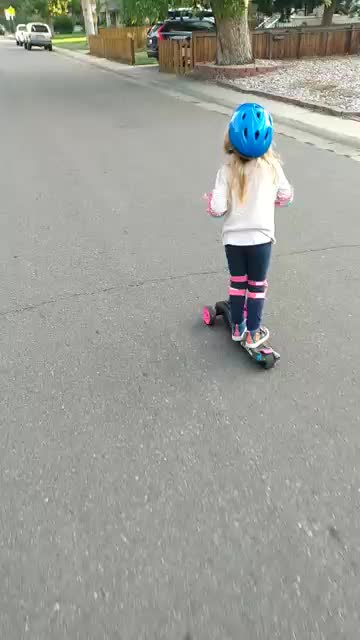4 Year Old Rollin through Denver on electric scooter to school