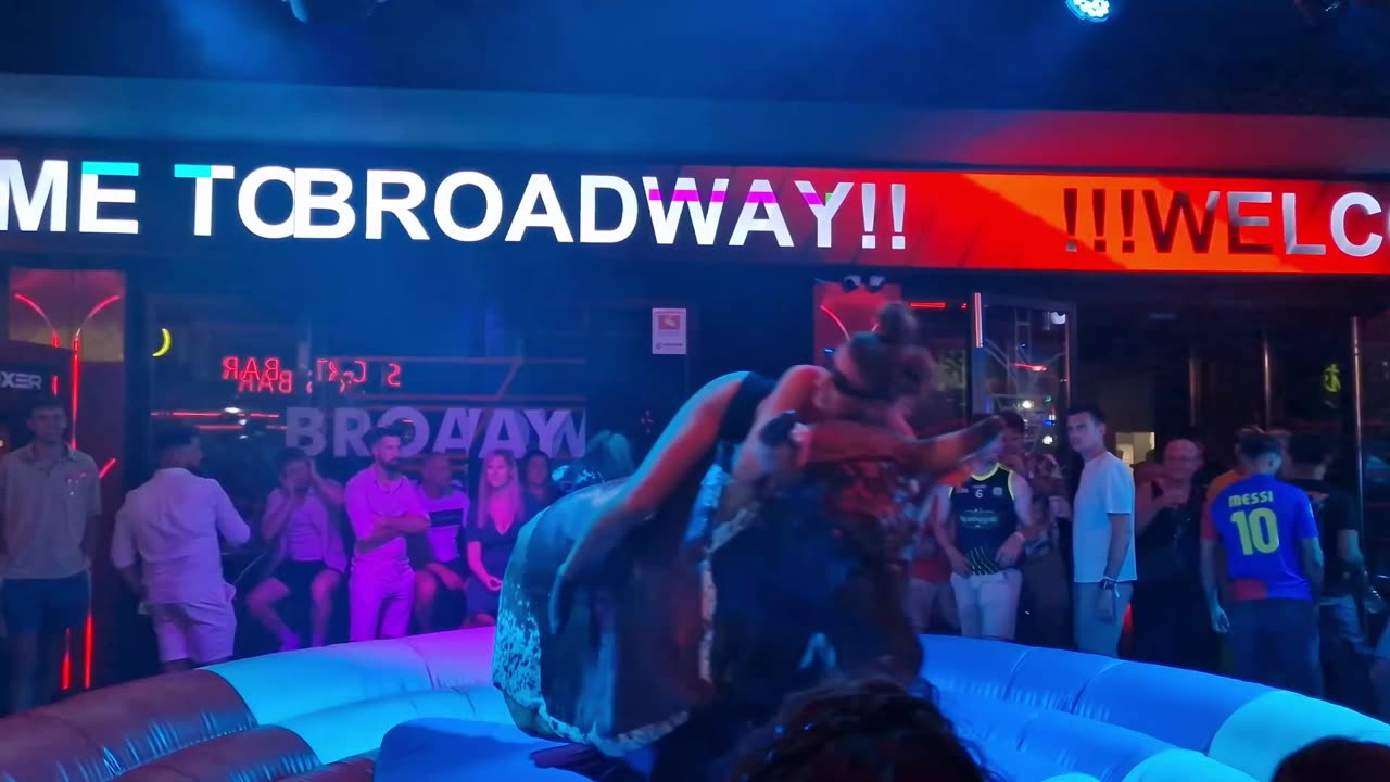 😱 OMG! Pretty Girl Fails at Mechanical Bull Ride in Benidorm | Spain 2024