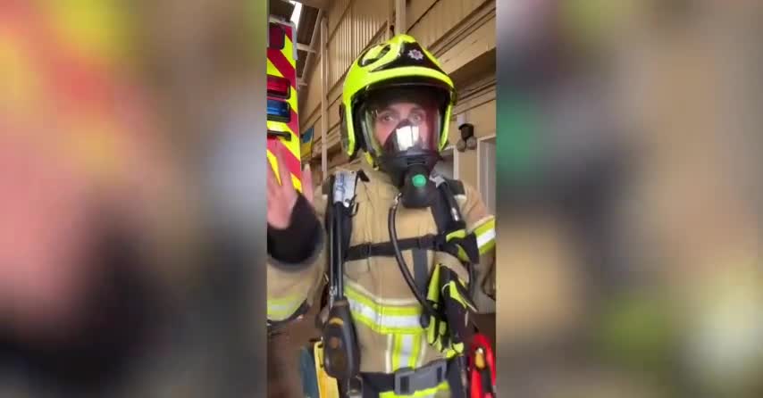 In this instructional video, a young female firefighter demonstrates how to put on safety gear.