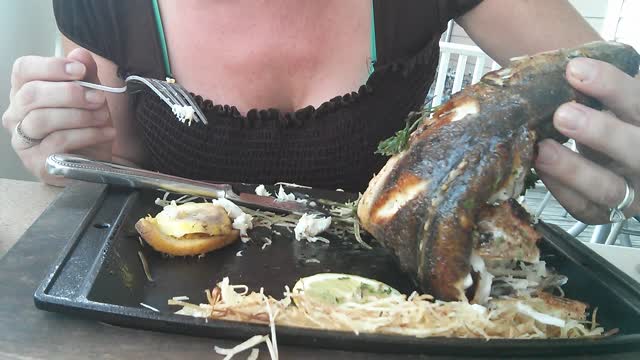 Fish head smiling at sweet woman