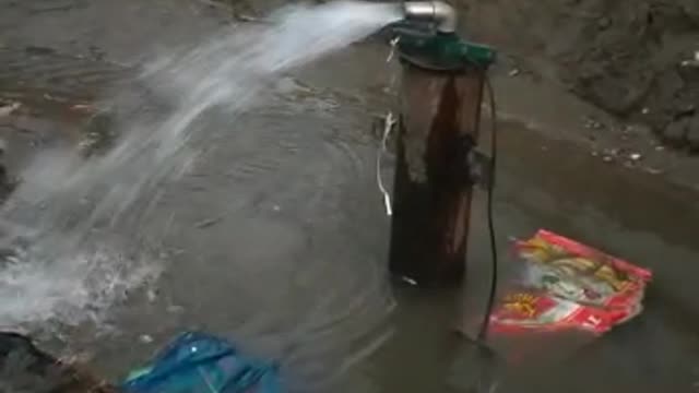 Submersible pump discharging Water from new tube well.