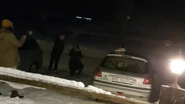 White shoes tries to jump off snow car falls on face