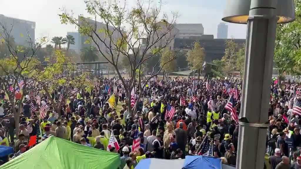 Thousands of people gather outside Los Angeles City Hall to protest vaccine mandates