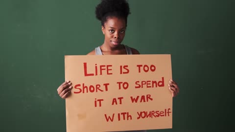 Woman Holding a Slogan