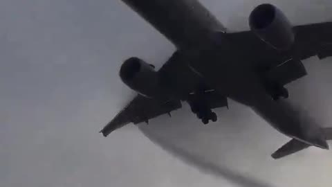 Example of wing condensation breaking through heavy fog for a Boeing 777.