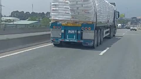 Packages Slip Off Truck and Spill Onto Roadway