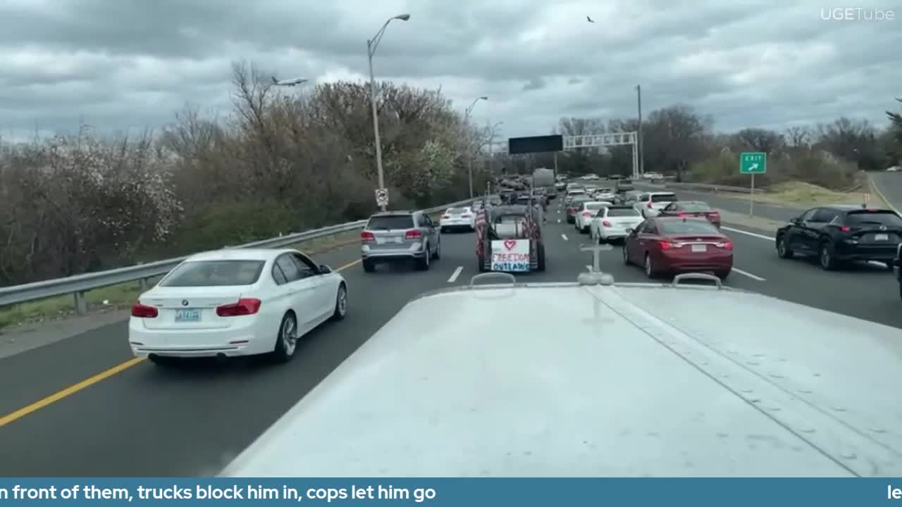 leftist in a tesla tries to cause bad accident by jamming on breaks in front of them, trucks block