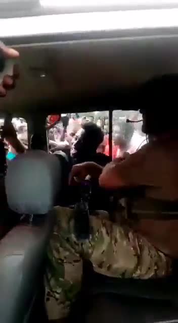 Guinea Coup: Soldier has US flag in T shirt.