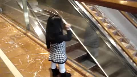 Chloe saying "bye" at the Copley Place Mall