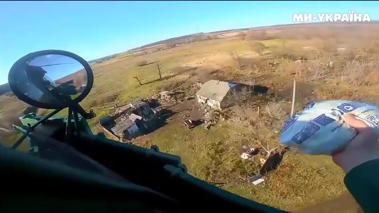 The pilot of the Ukrainian Mi-8 drops candy to girls who constantly met our pilots