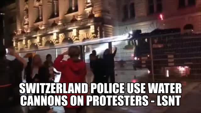 Switzerland Police Use Water Cannons On Protesters