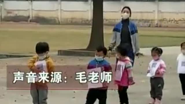 Chinese kindergarteners with QR codes hung around their necks in queue for COVID testing