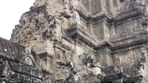 Exploring Angkor Wat Temple during rainy season