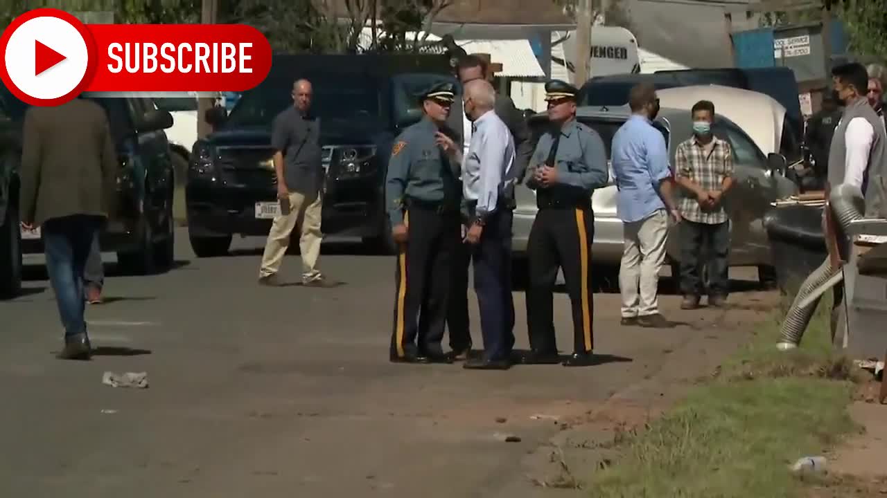 Joe Biden takes barrage of heckles from people behind Fence waving Trump flag touring Hurricane Ida