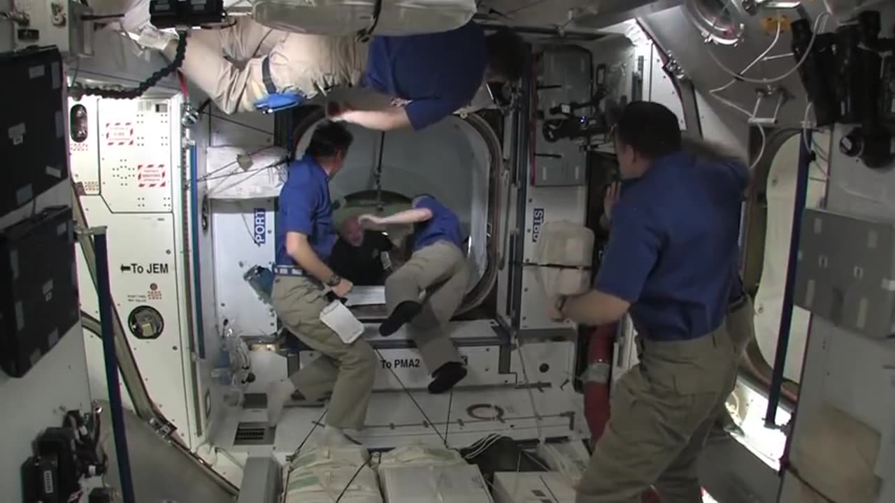 Shuttle Crew Welcomed Aboard Space Station