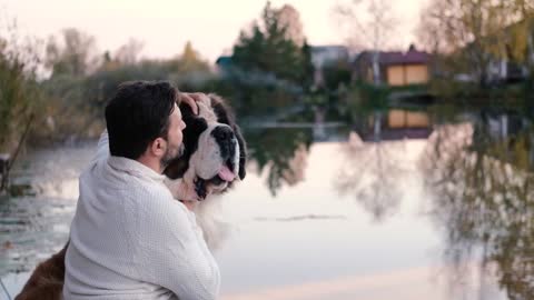 Friendship concept, man and dog sitting together