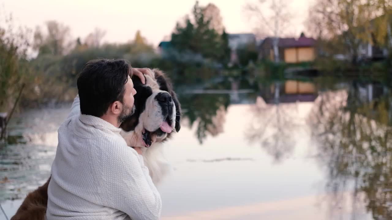 Friendship concept, man and dog sitting together