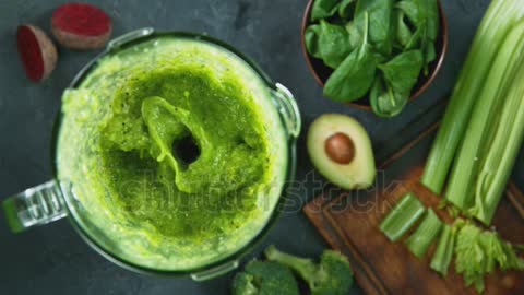 Green fresh smoothie blended in blender