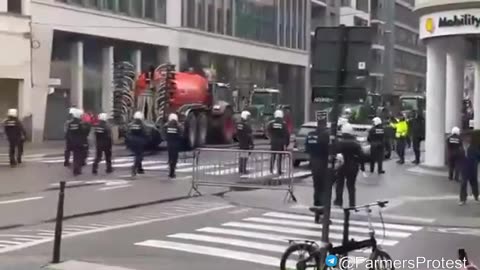 Farmers spray dung on police!