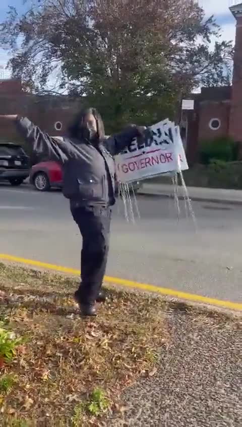 NYPD cop stealing Lee Zeldin signs