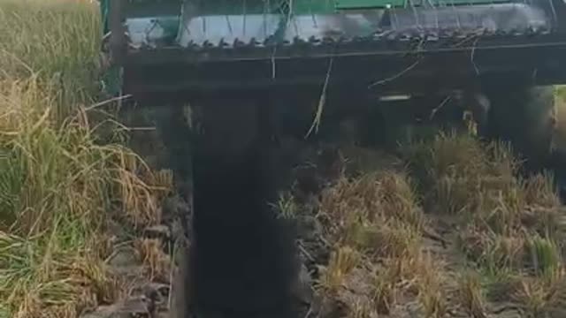 John deere harvester stuck in mud