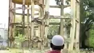 See a Small Water Tower Being Demolished