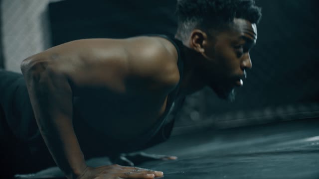 Man Doing Press Ups in Gym