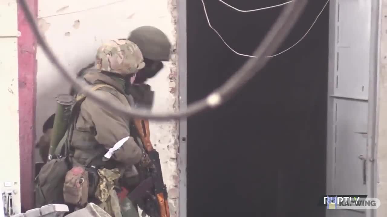 DNR soldiers advance and check one of the factories of Azov steel plant