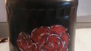 Acrylic painted glass jar with red flowers