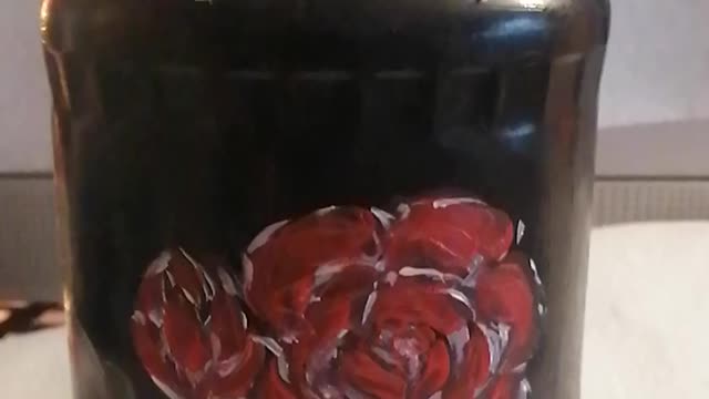 Acrylic painted glass jar with red flowers