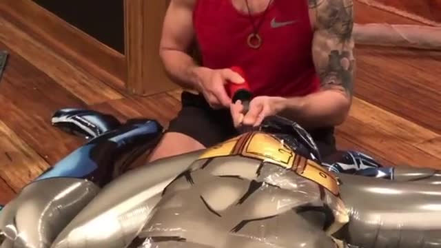 Watch this man die inside while pumping Batman Balloon
