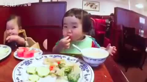 Chinese Cute Toddler enjoyed a non stop ate veggies