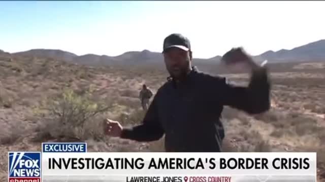 Lawrence Jones speaks with migrants at southern border