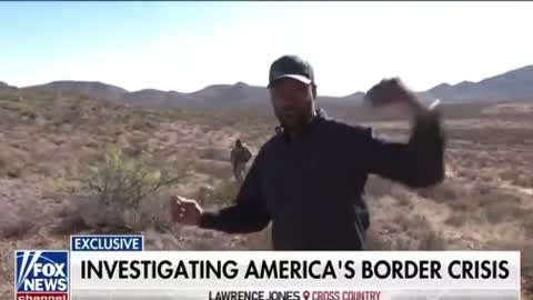 Lawrence Jones speaks with migrants at southern border