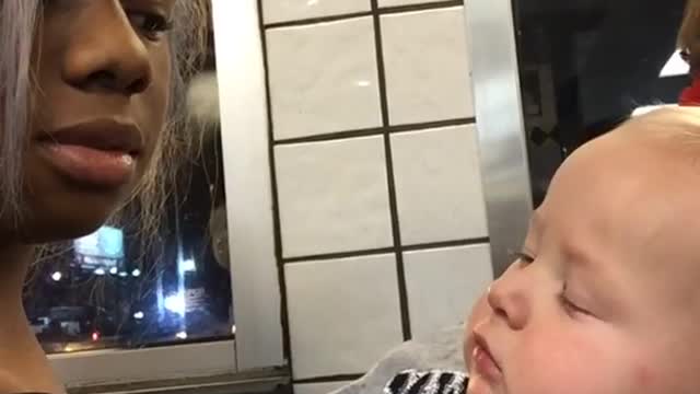 Cute Baby Stares At Woman Then Smirks