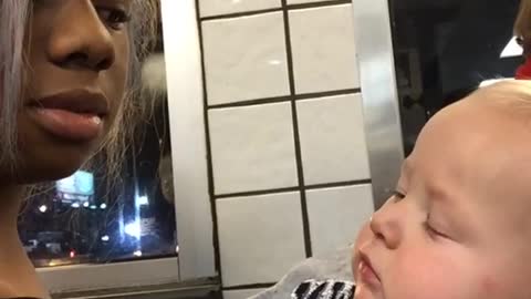 Cute Baby Stares At Woman Then Smirks