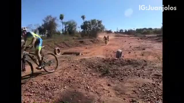 People on dirt bikes man in red face plants and flips