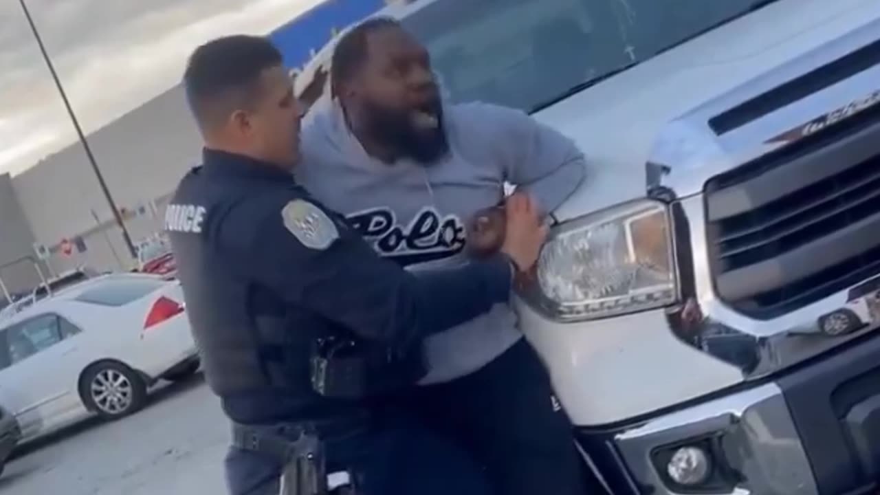 Man gets into a physical altercation with a police officer in a Walmart parking lot