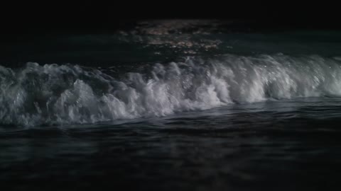 Sea waves washing against the shore