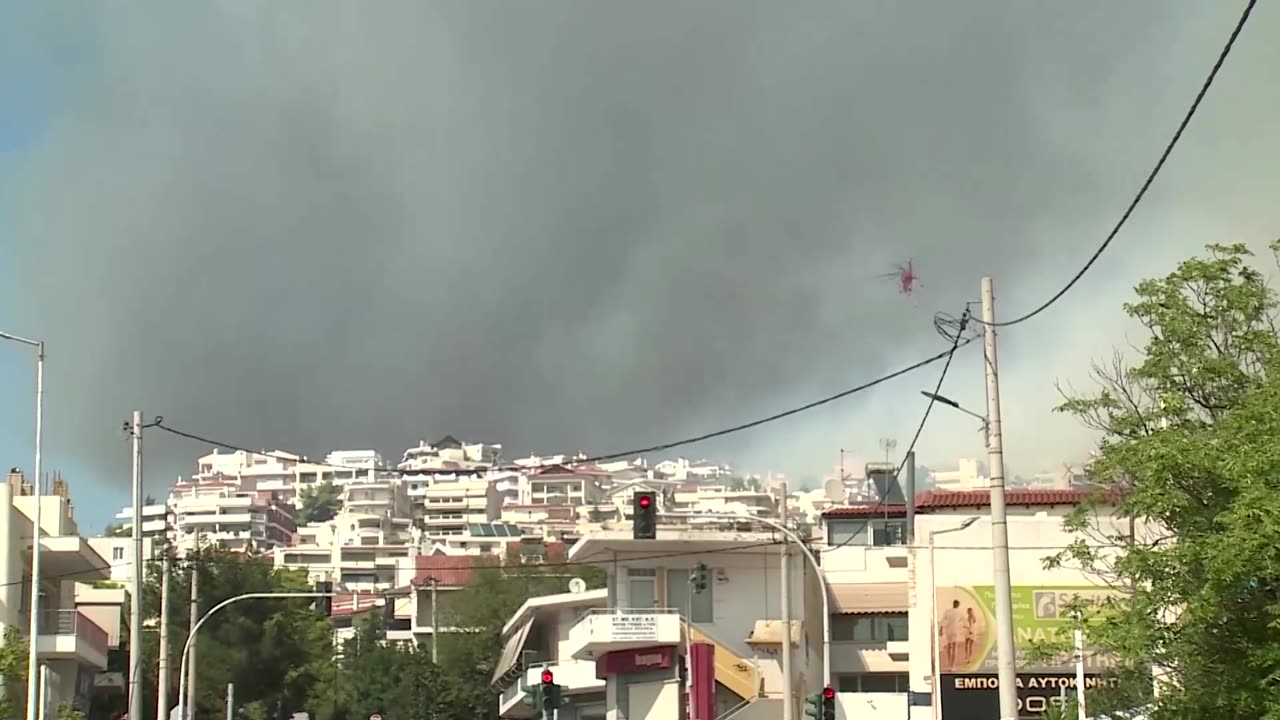 Athens wildfire reaches suburbs as Greece calls in Europe's help