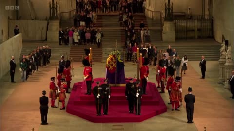 A Guard Standing Near The Queen’s Coffin Collapses